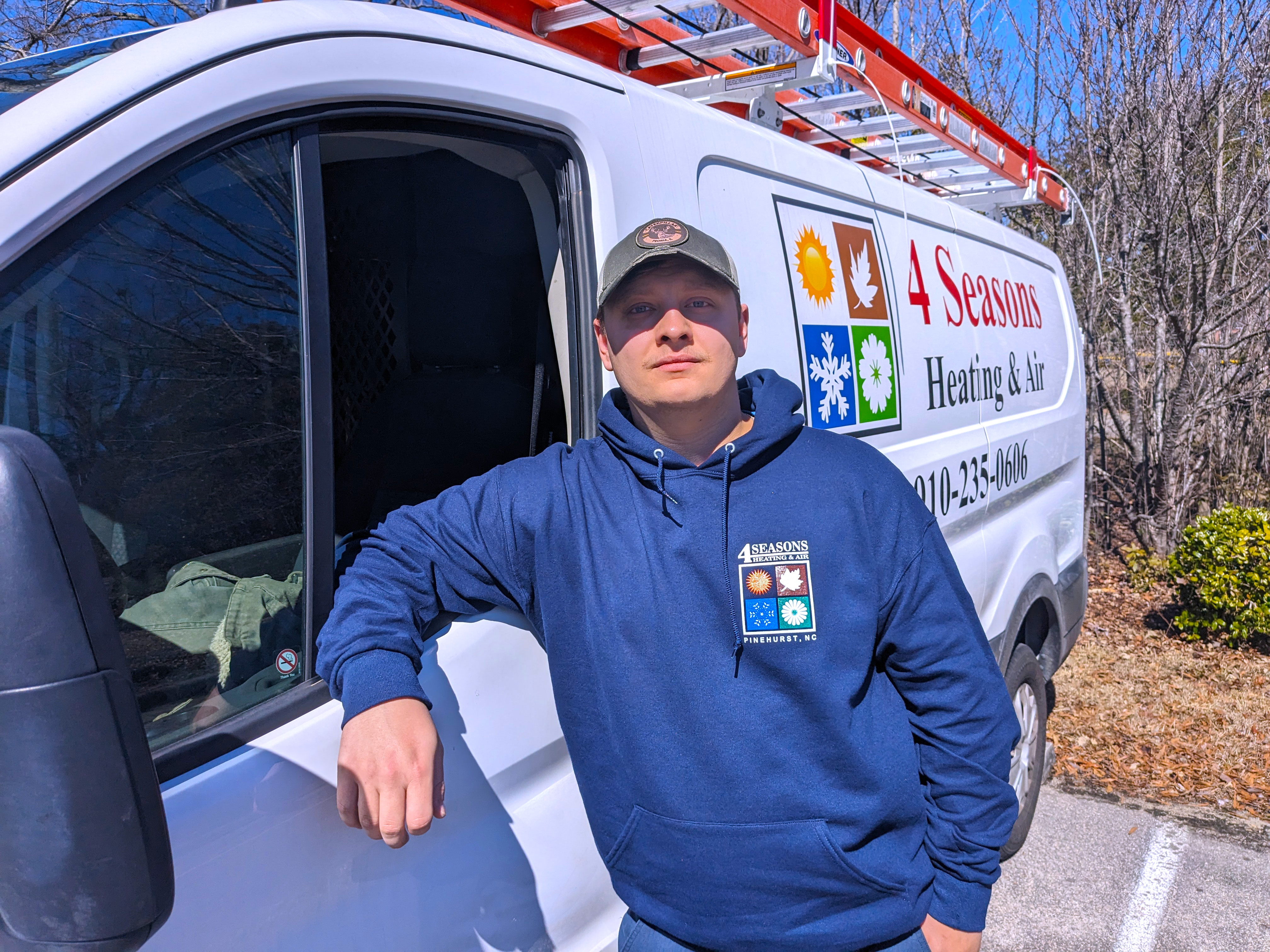 Bryan Stevens stands with his service van.