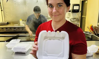 Jeanette Lopez holds a dish made at her restaurant.