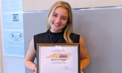 Madison Gentry holds her award.