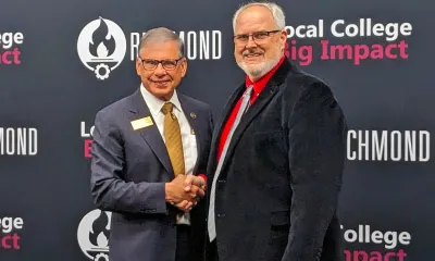 Dr. Cummings and President Barbee shake hands.