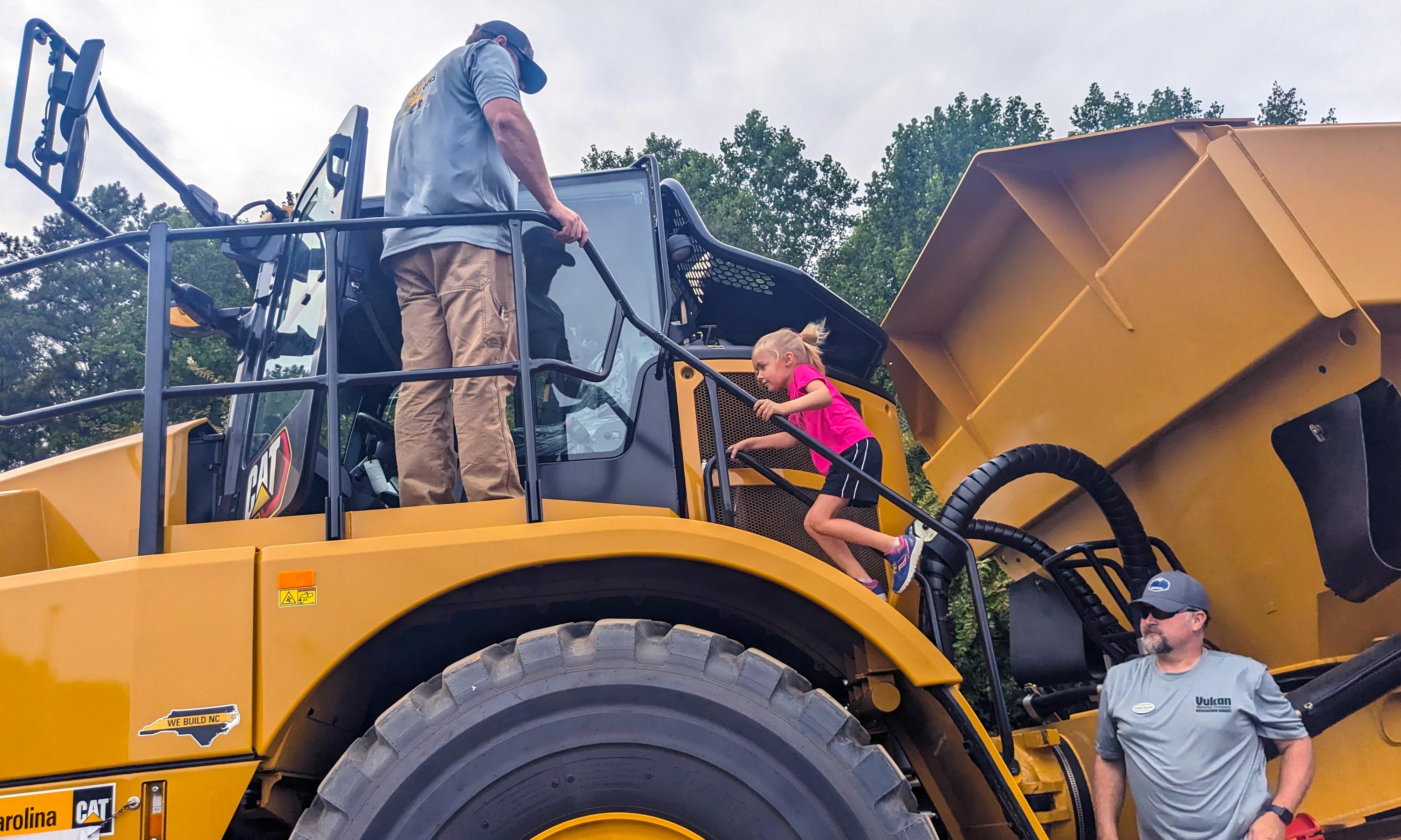 Child runs up on tractor