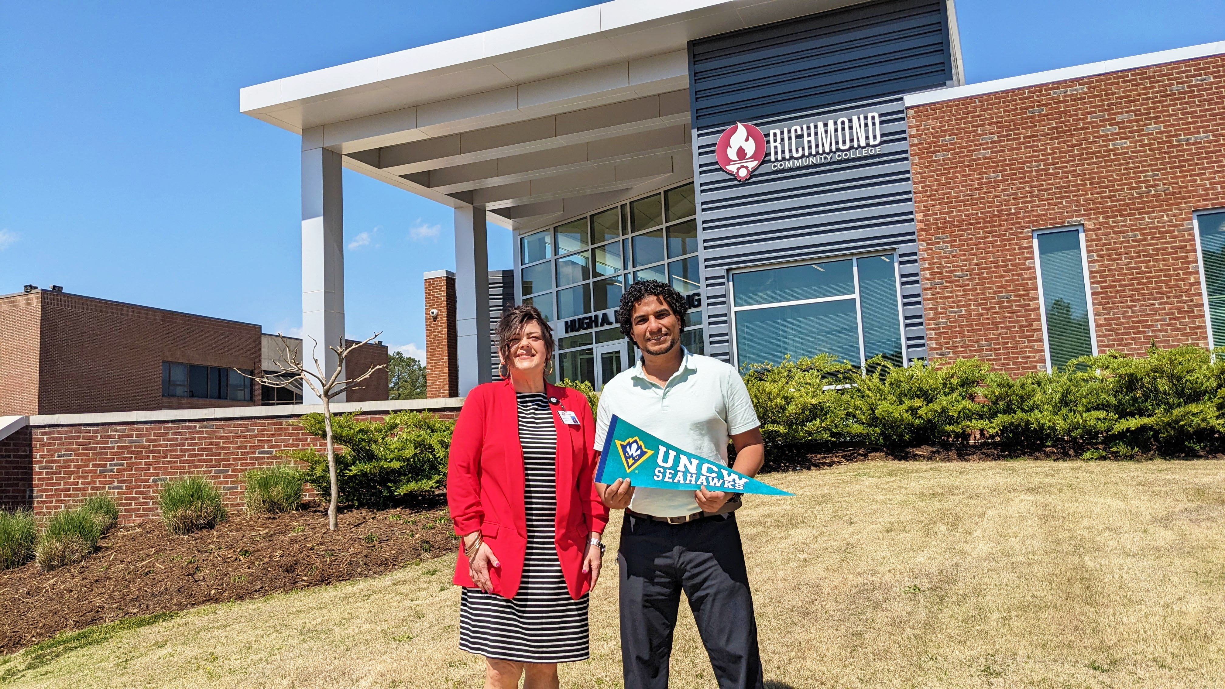 Aussem Hussien stands with Human Services Program Coordinator Amanda McKenzie
