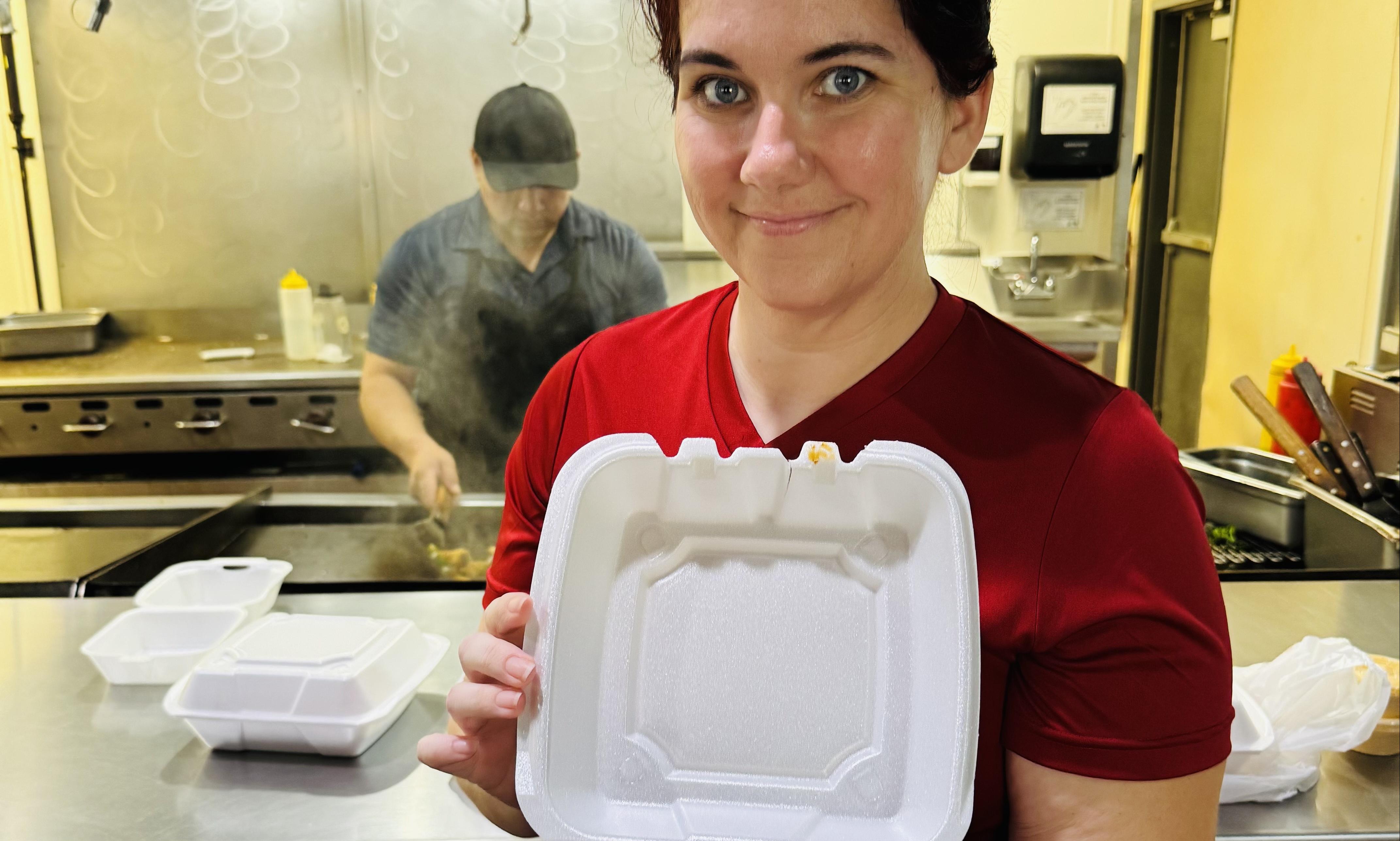 Jeanette Lopez holds a dish made at her restaurant.